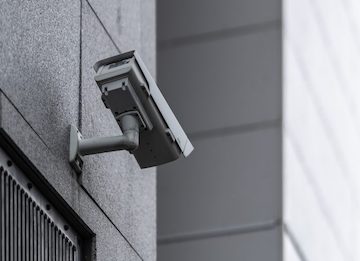 Photo of a security camera on the outside of a building