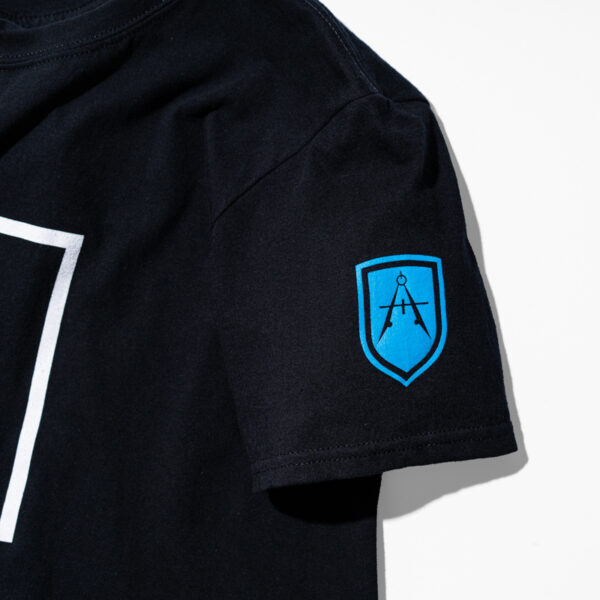 Sleeve of black t-shirt with blue Adamo logo