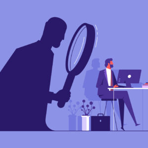 An illustration of a man at a desk being watched by a large silhouette through a magnifying glass